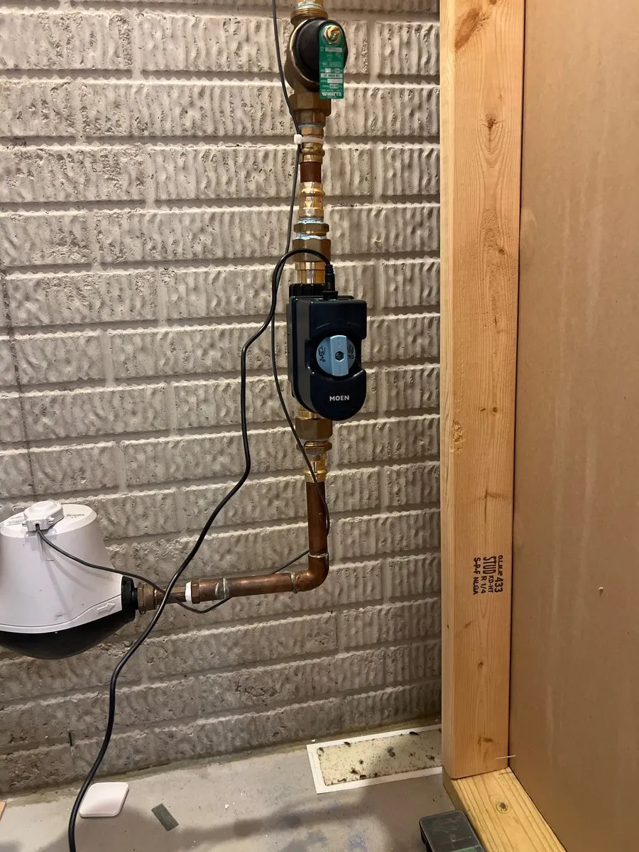Moen Flo shutoff installed on a copper main water line in an Akron basement