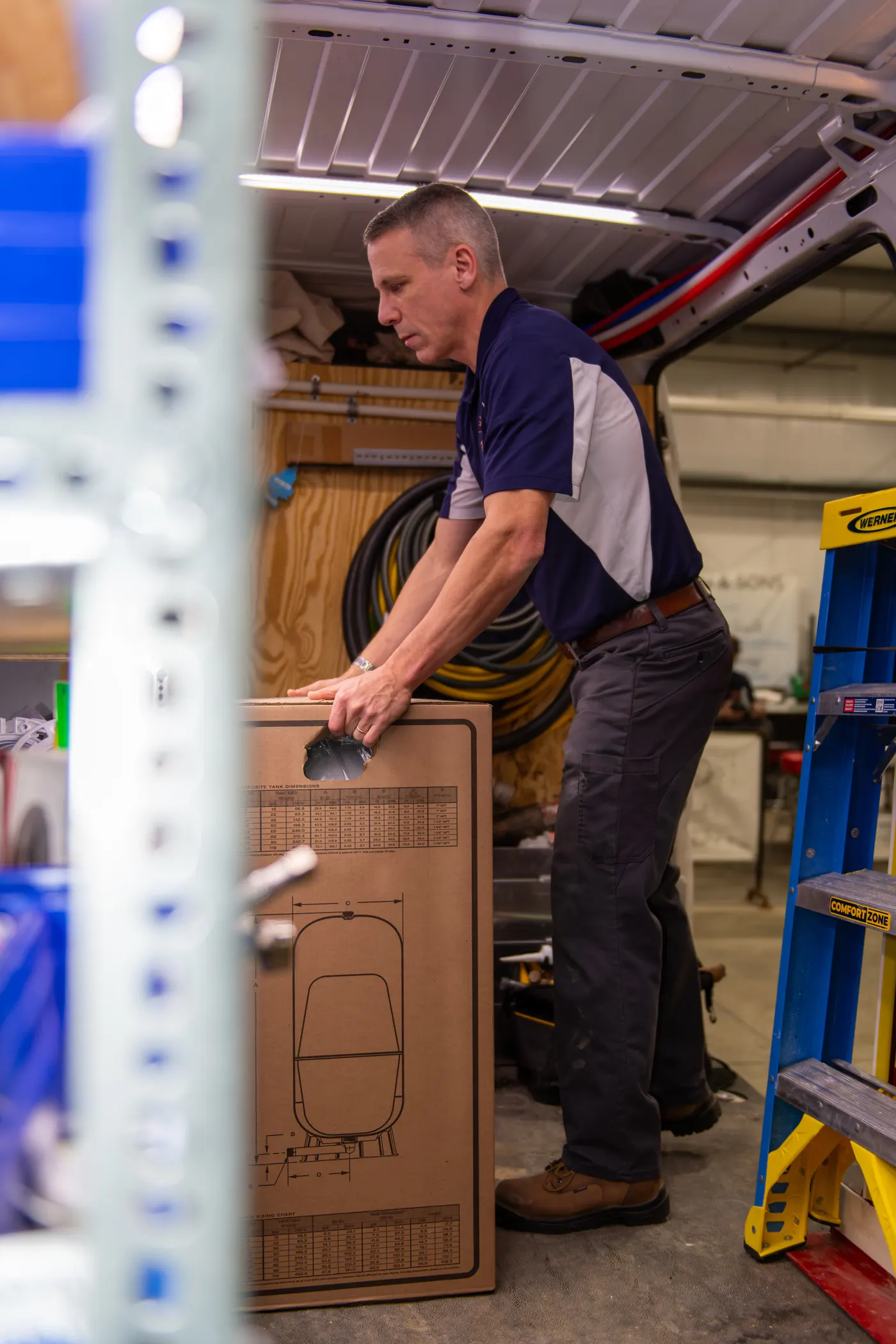 A Mackin & Sons plumber working out of a stocked van